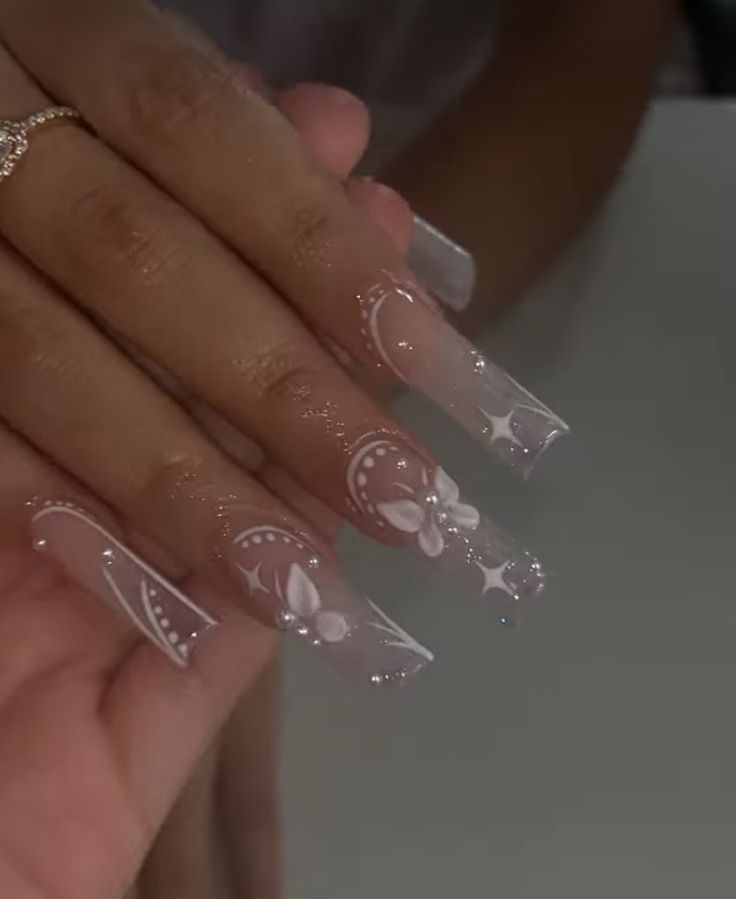 Whimsical Elegant Nail Design with Translucent Tips and Delicate Patterns