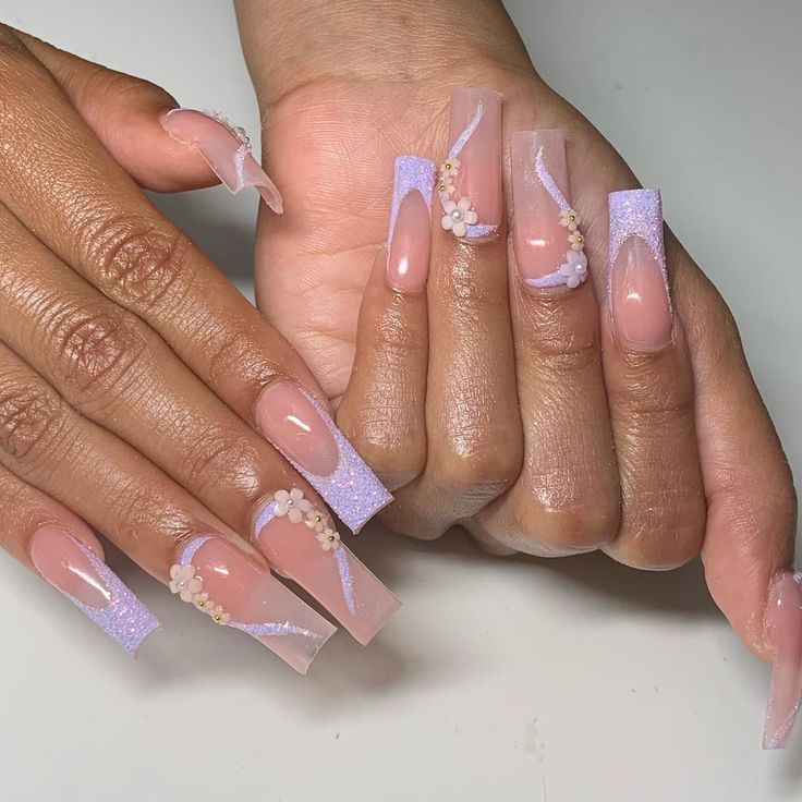 Elegant Pastel Nail Design with Lavender, Floral Accents, and Chic Long Tips