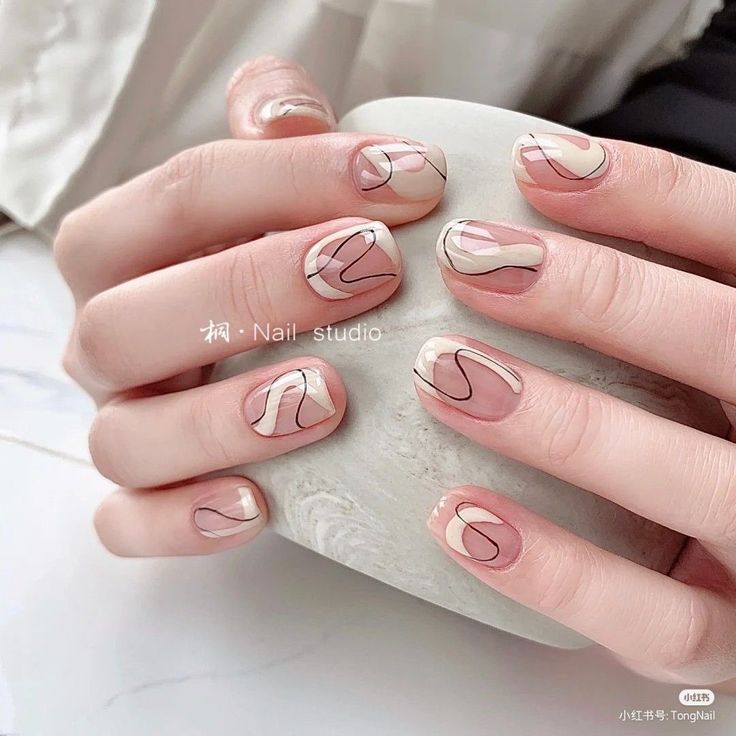 Chic Neutral Nail Design with Artistic Flair and Sophisticated Simplicity.