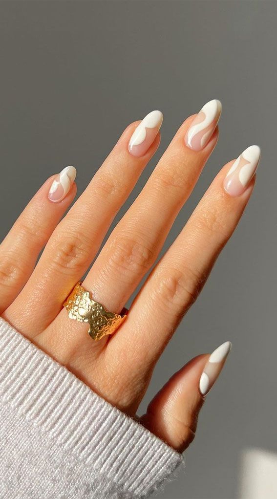 Sophisticated Nail Design: Elegant White and Nude Blend with Chic Gold Accents.