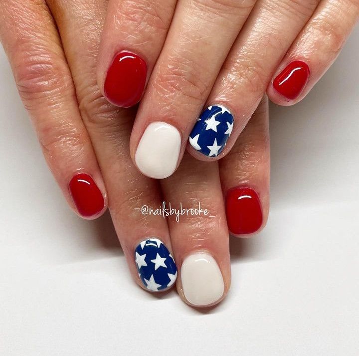 Patriotic Red and White Nail Design with Starry Accents