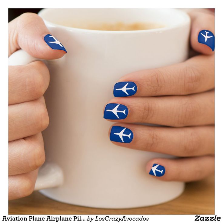 Vibrant Blue Nail Design with White Airplane Silhouettes for Travel Enthusiasts