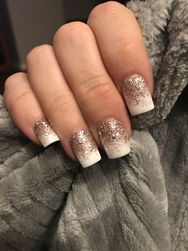 Sophisticated Ombre French Tip Nails with Glittering Rose Gold Accent.