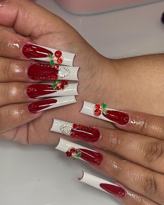 Festive Holiday Nail Design: Bold Red Base with Glossy White Accents and Sparkling Green Details.