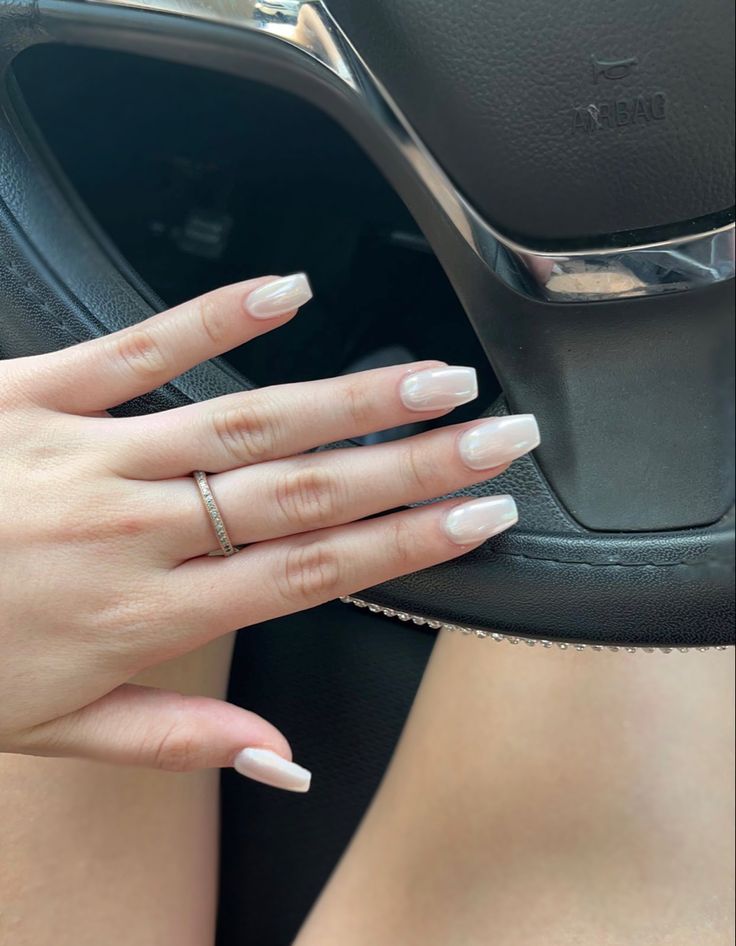 Chic Nude Acrylic Nails with Elegant Square Tips and Delicate Ring.