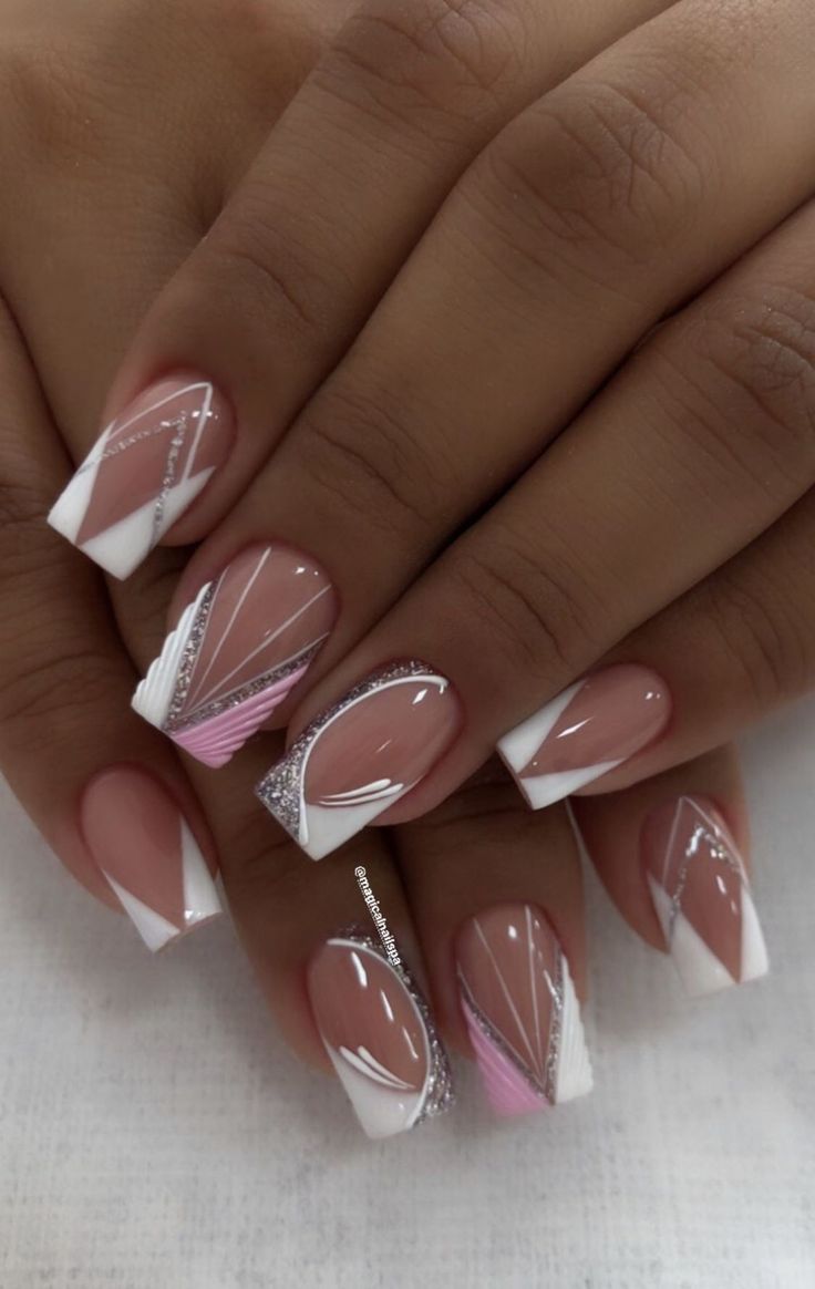 Chic Soft Pink and White Nail Design with Glamorous Silver Accents.