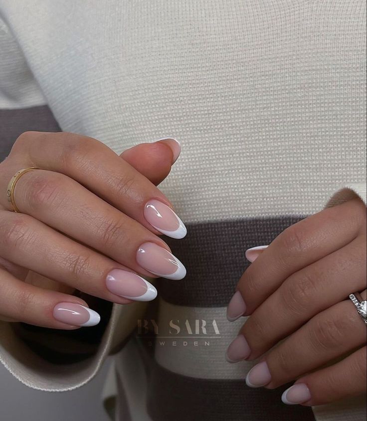 Chic Almond-Shaped French Manicure with Soft Pink and White Tips.