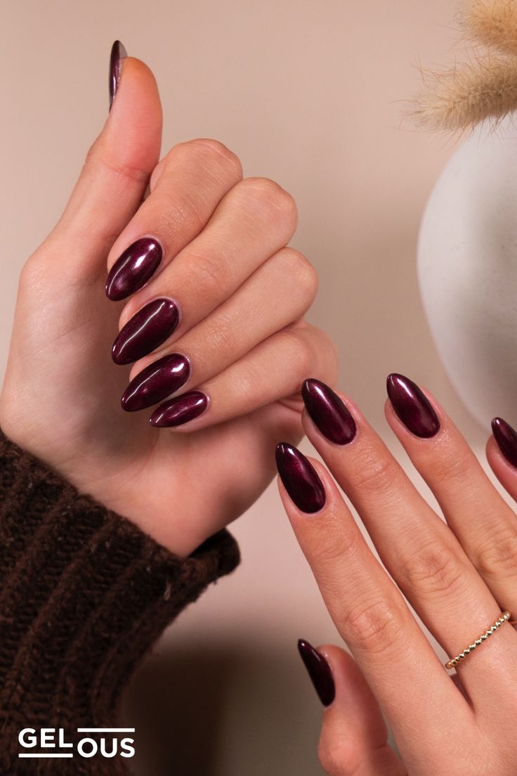 Sophisticated Deep Burgundy Almond-Shaped Nails with Glossy Finish.