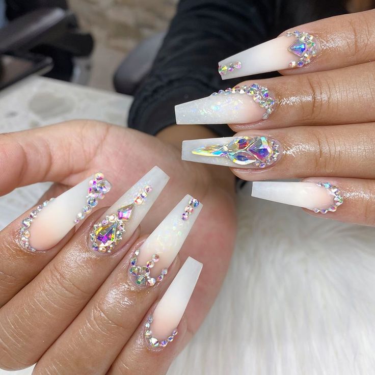 Elegant Long Nails with Iridescent Rhinestones and Gradient Shine for Glamourous Occasions.