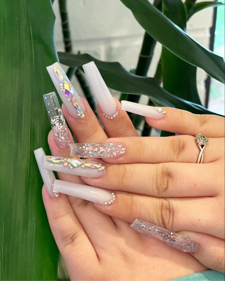 Chic Pastel Acrylic Nail Art: Glamorous Designs with Glitter and Rhinestones.