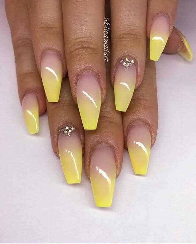 Vibrant Ombre Yellow Nails: A Playful and Elegant Gradient Design with Rhinestones.