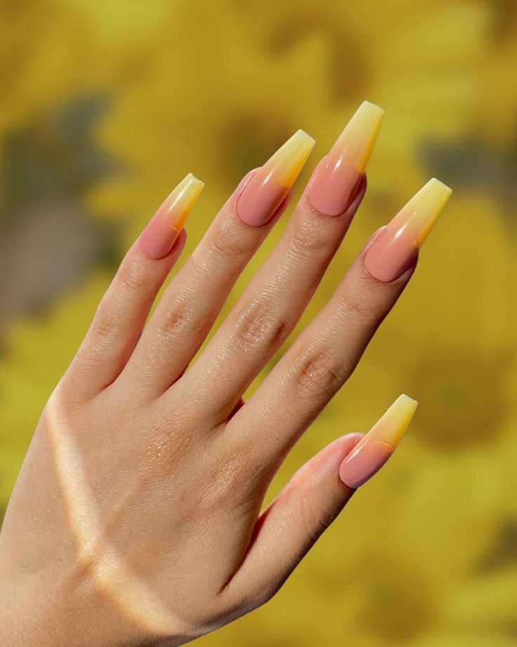 Playful Yet Sophisticated Ombre Nail Design in Soft Pink and Vibrant Yellow.